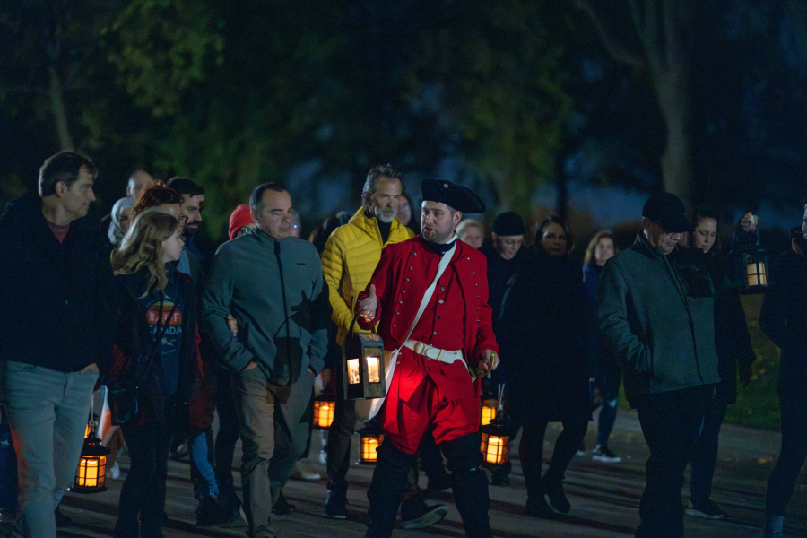 Photo of visitors walking outside with lanterns