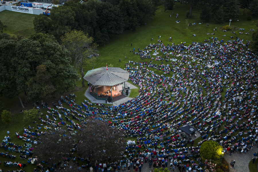 Aerial view of an outdoor show at the Edwin Bélanger Bandstand with a crowd