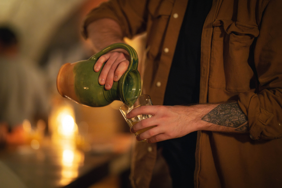 Photo of the activity The convict's last drink, in which a man pours a liquid into a glass